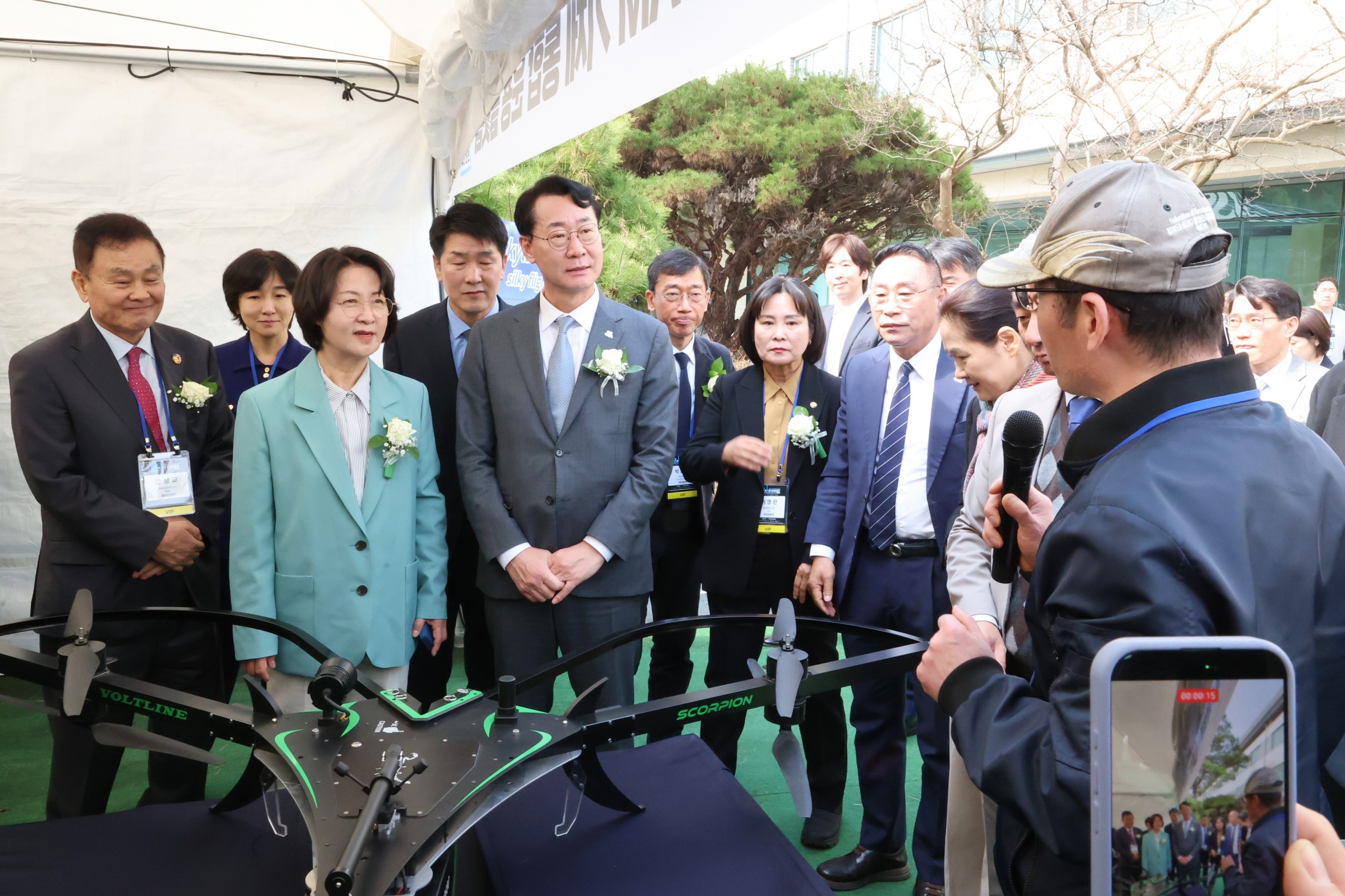Governor Choo Mi-ae of Gyeonggi Province and Mayor Jeong Myeong-geun of Hwaseong Special City receiving explanations at a booth at the MARS 2026 Investment Attraction & Conference